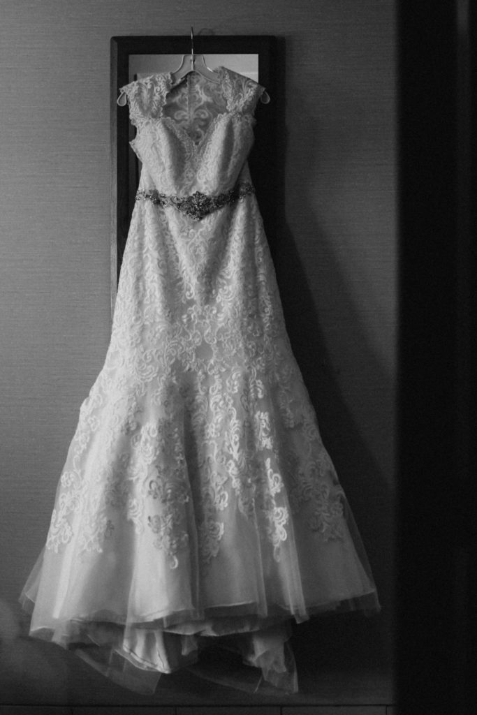 wedding dress hanging, black and white image