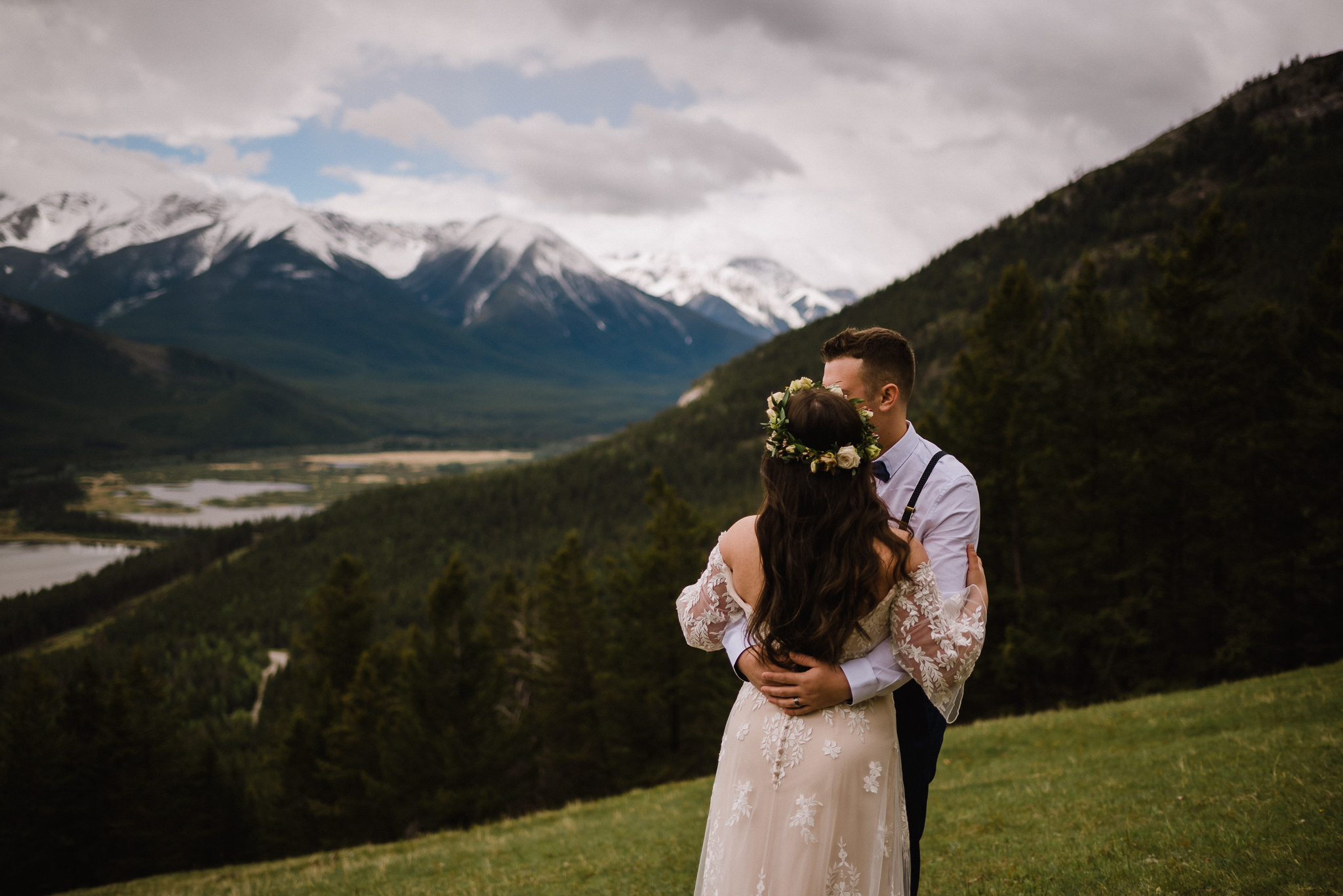 Bride and groom hugging at Mount Norquay Lookout, Banff