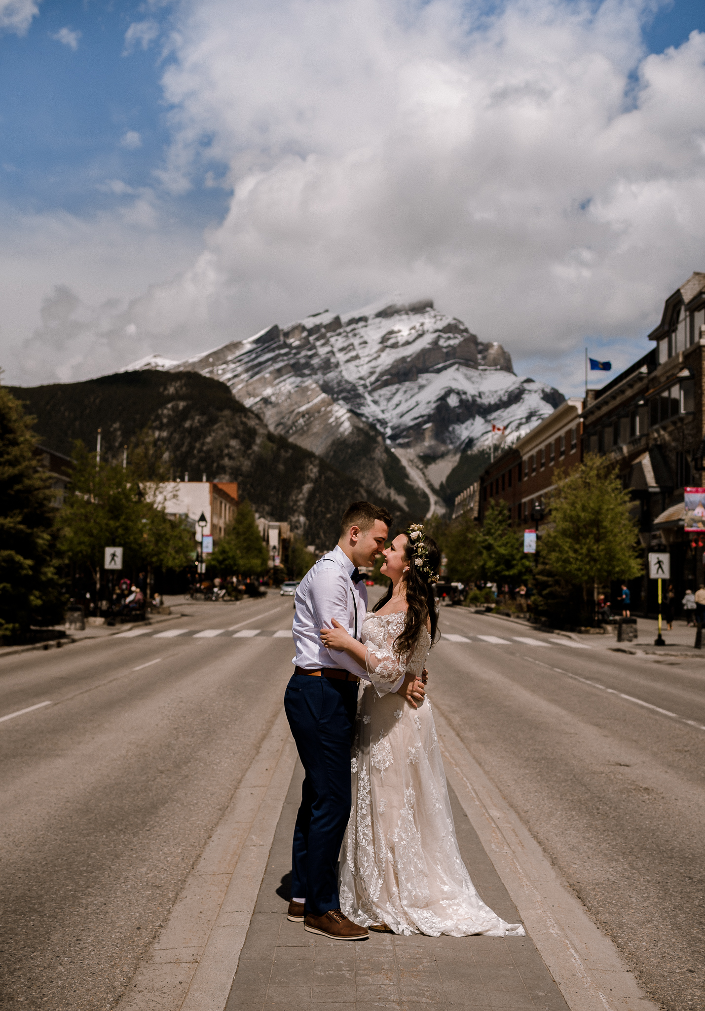 Bride and groom standing on platform at Banff, Alberta