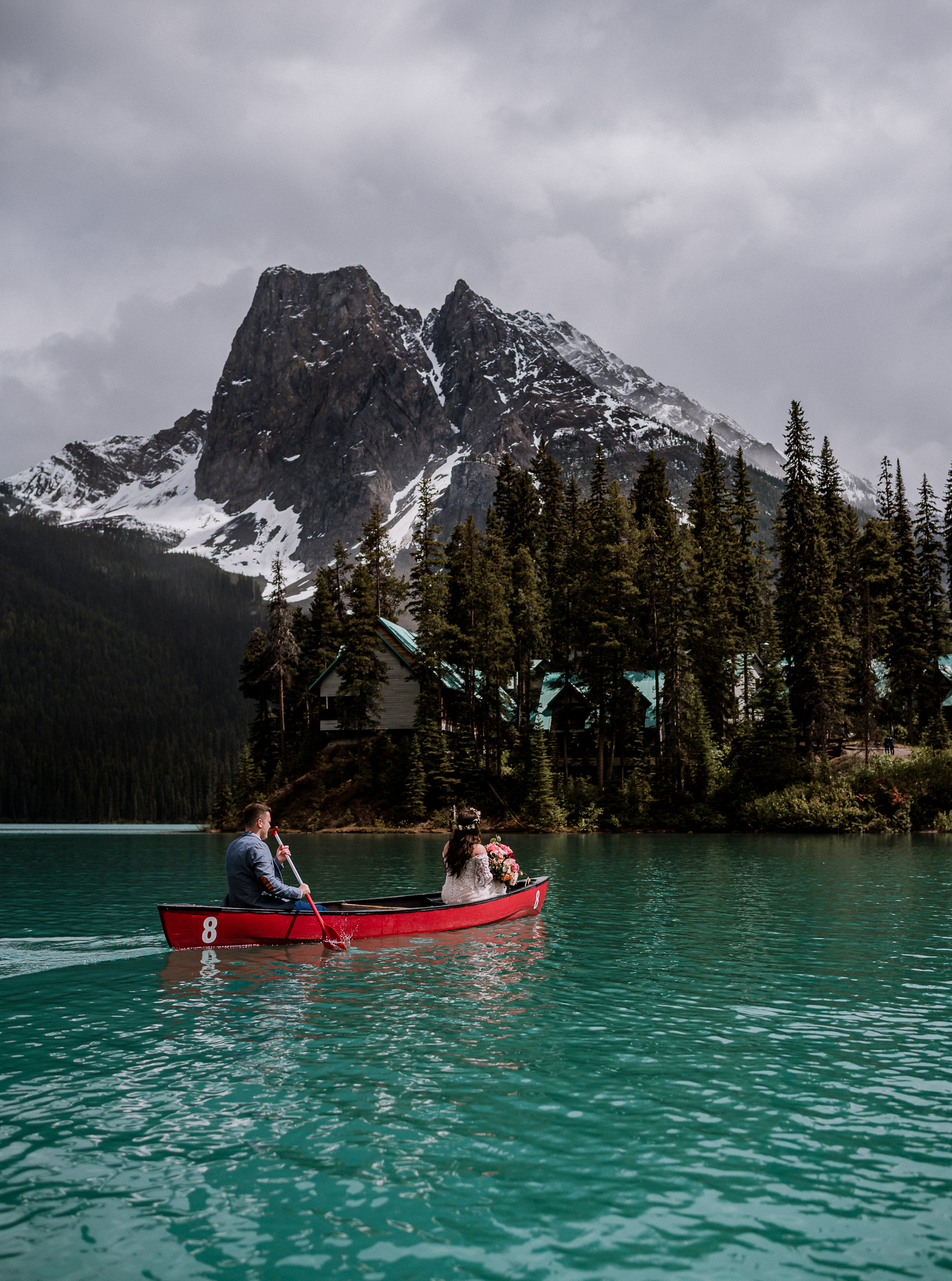 Bride and groom canoeing at Emerald Lake, BC
